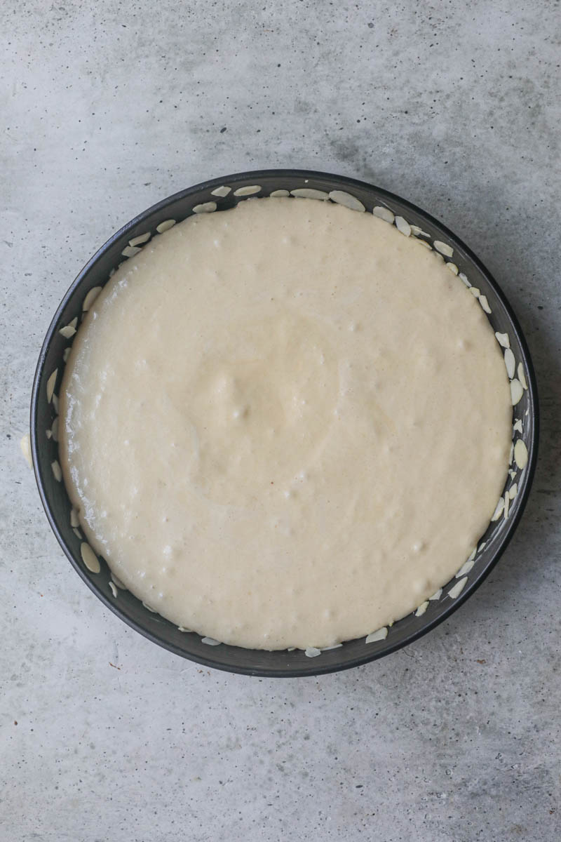 THe almond paste cake inside the cake tin ready for the oven.