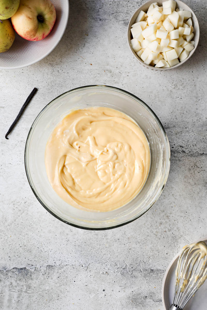 Overhead shot of the yogurt cake batter in a glass bowl