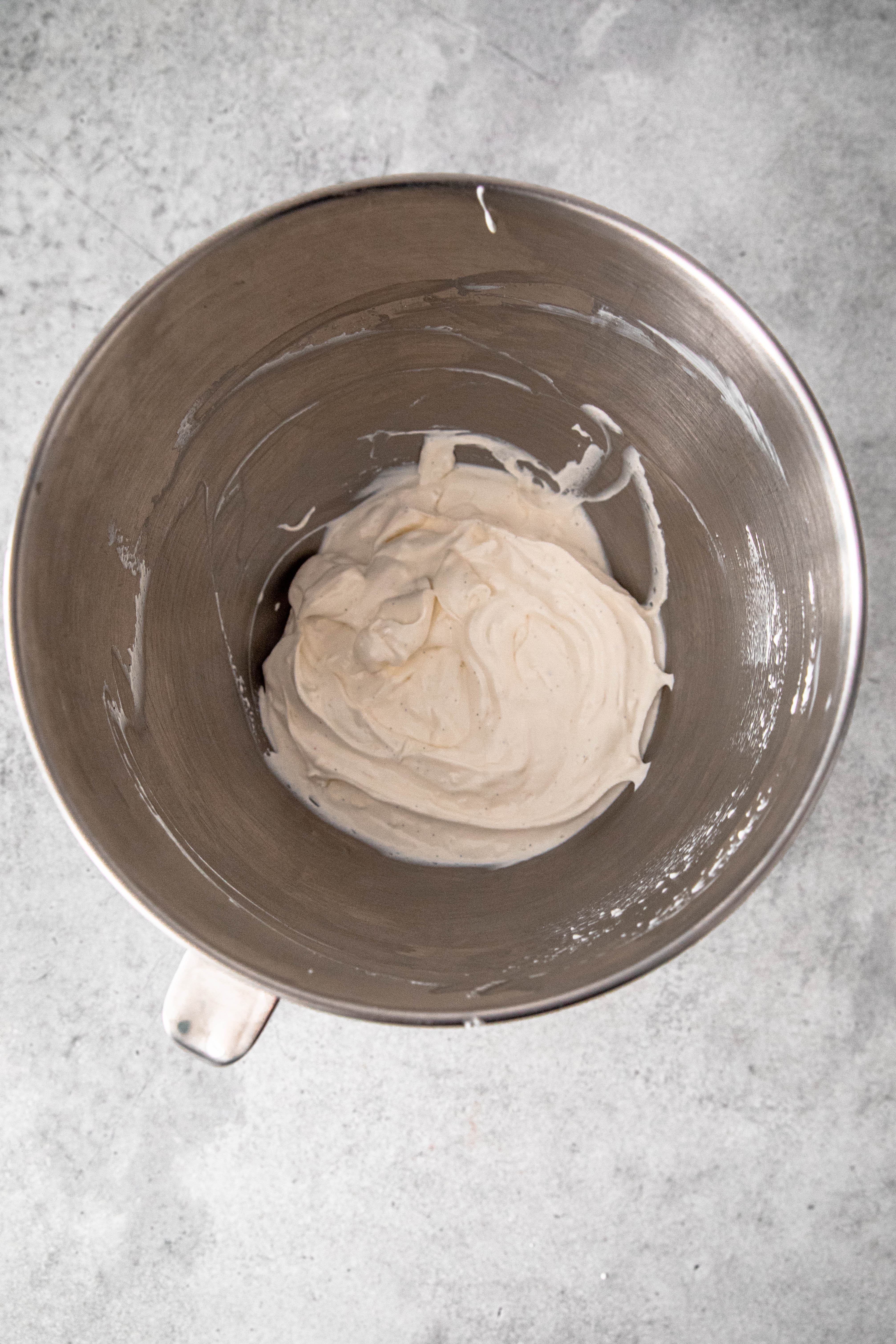 A bowl with the vanilla mascarpone cream mixed.