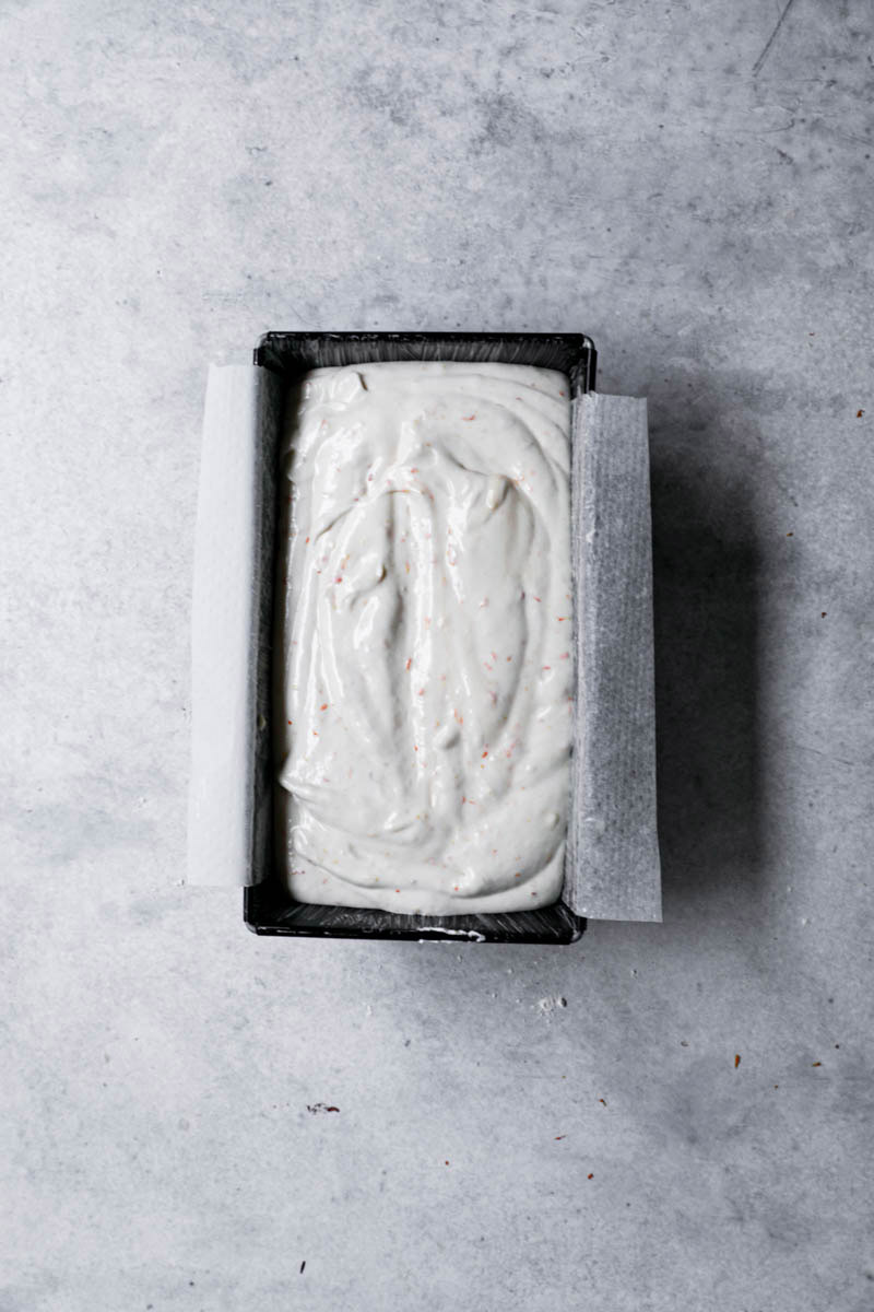 Blood orange cake inside the cake pan ready to be baked.