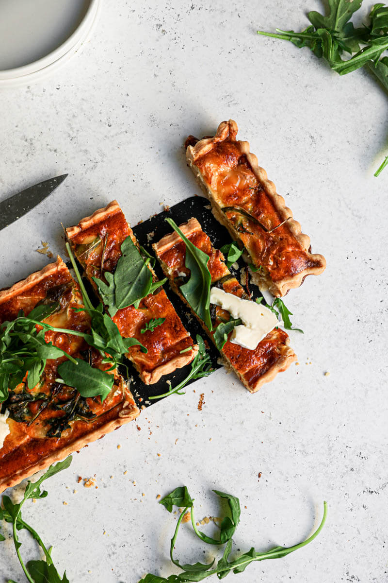 Overhead shot of 3 slices of the brie and caramelized onion quiche