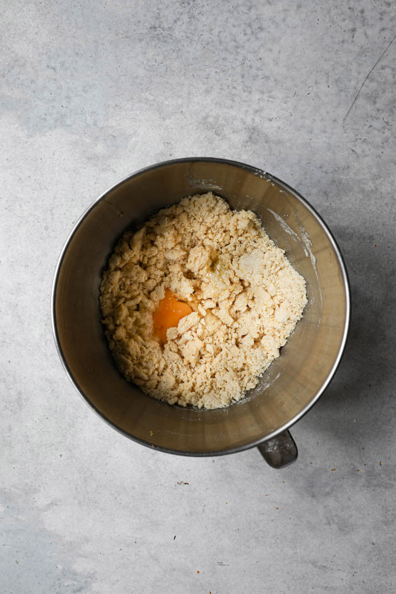 The bugnes dough inside a bowl ready to be kneaded