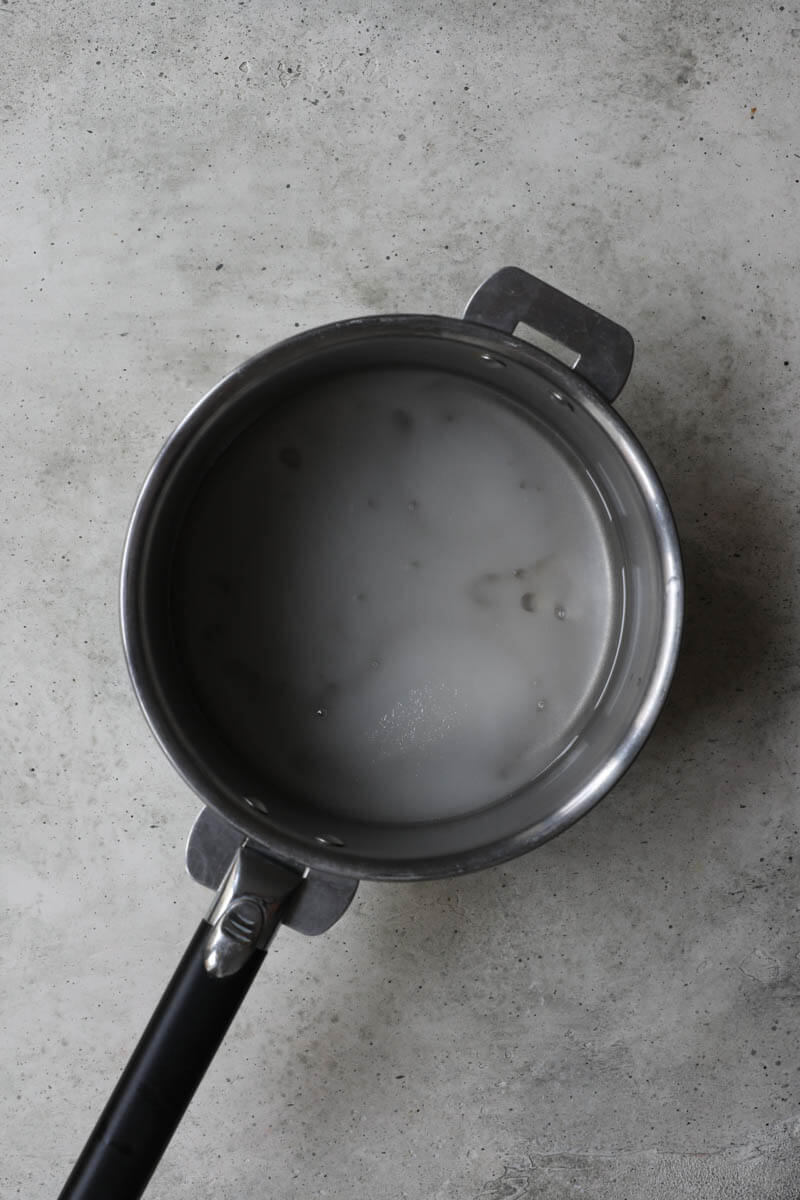 A pan with sugar, glucose, and water