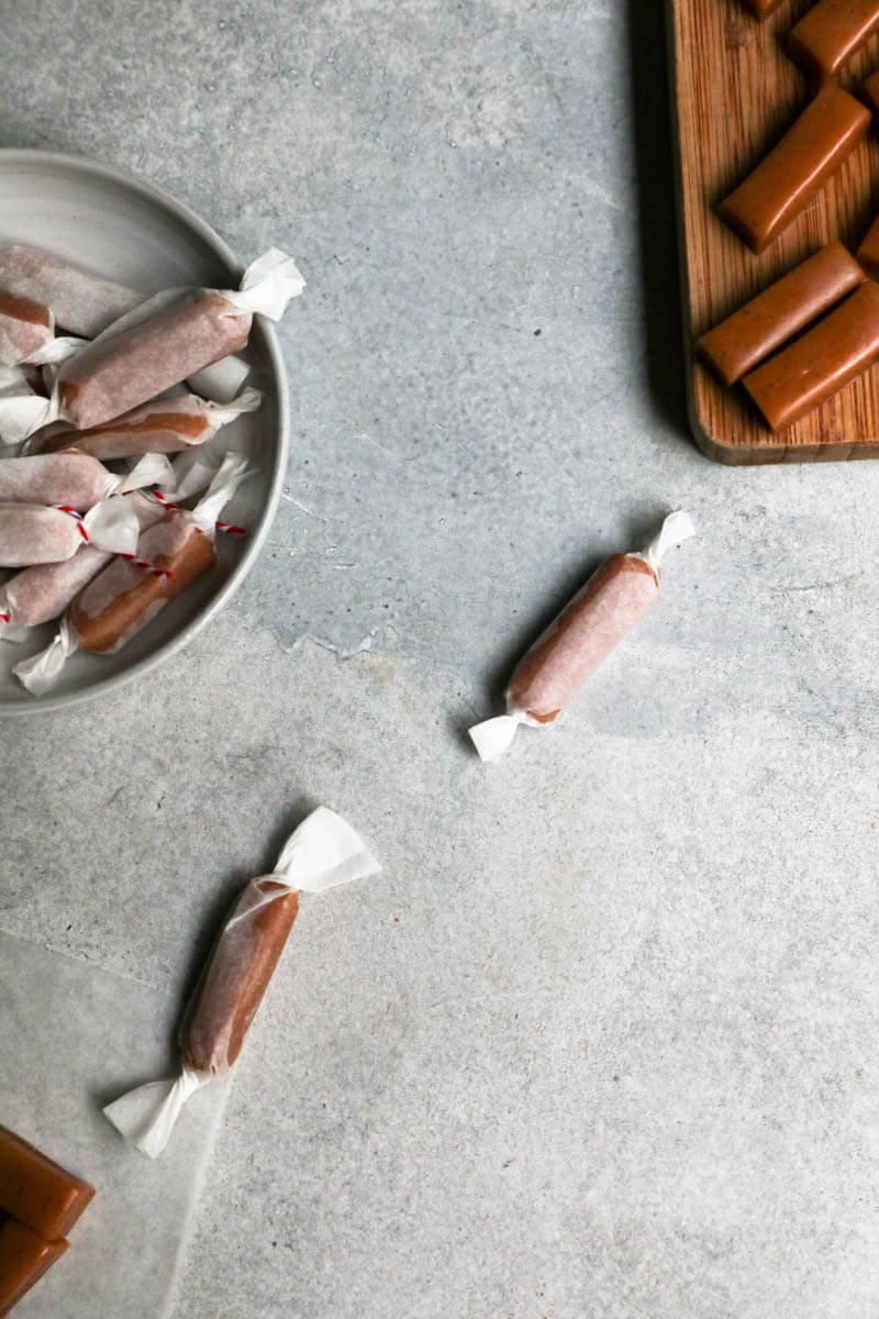 Wrapped caramel candies in parchment paper