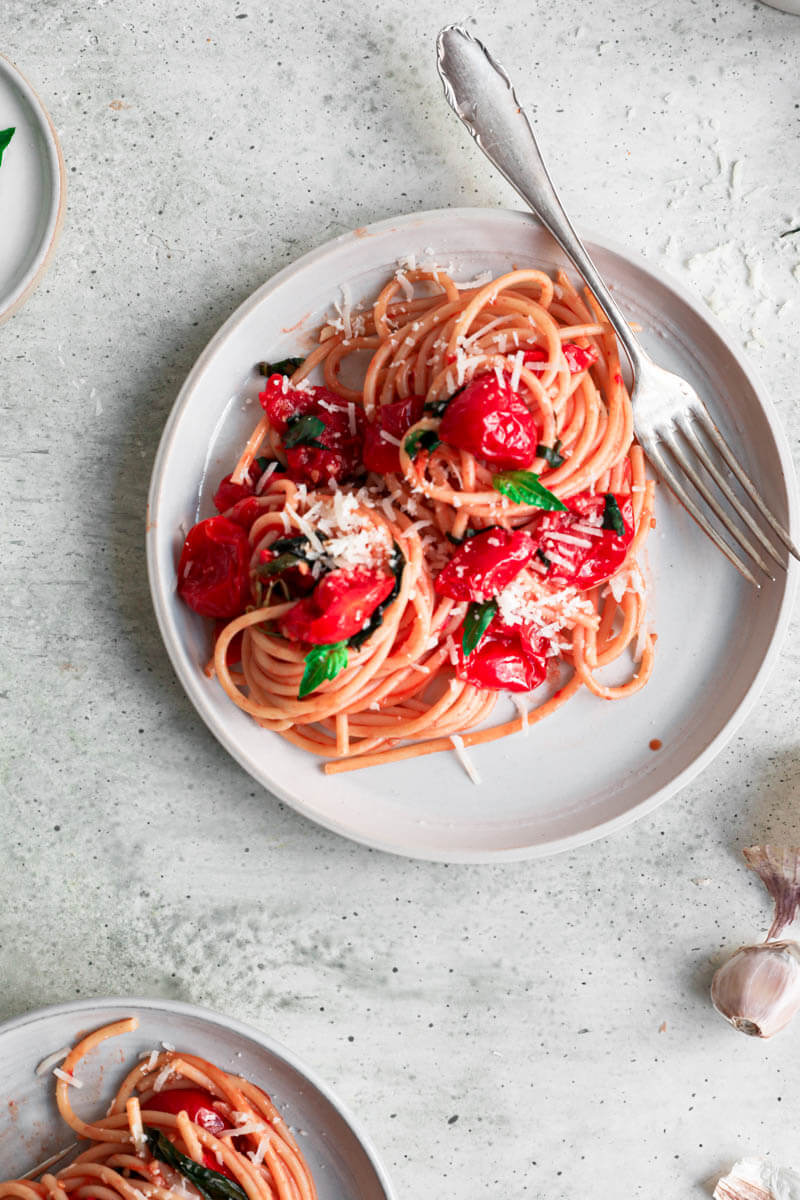 Overhead shot of one plate with cherry tomato pasta