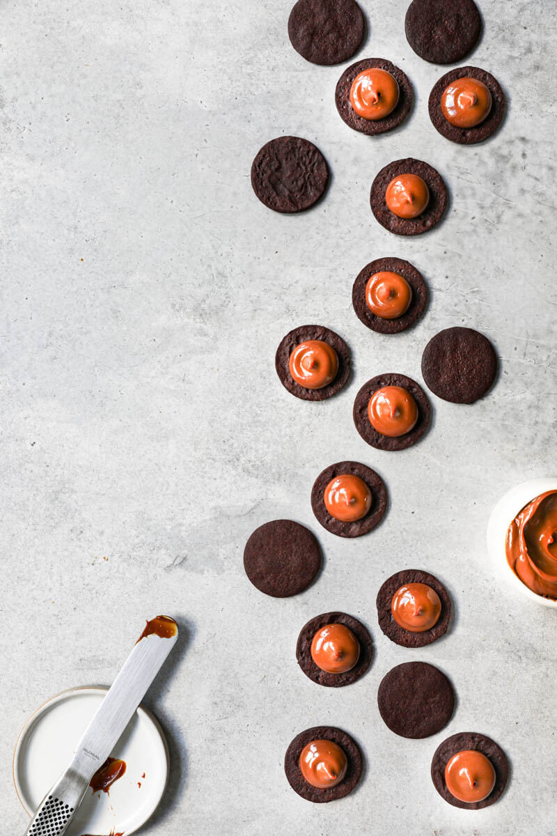 Overhead shot of the alfajores cookies turned around and filled with dulce de leche