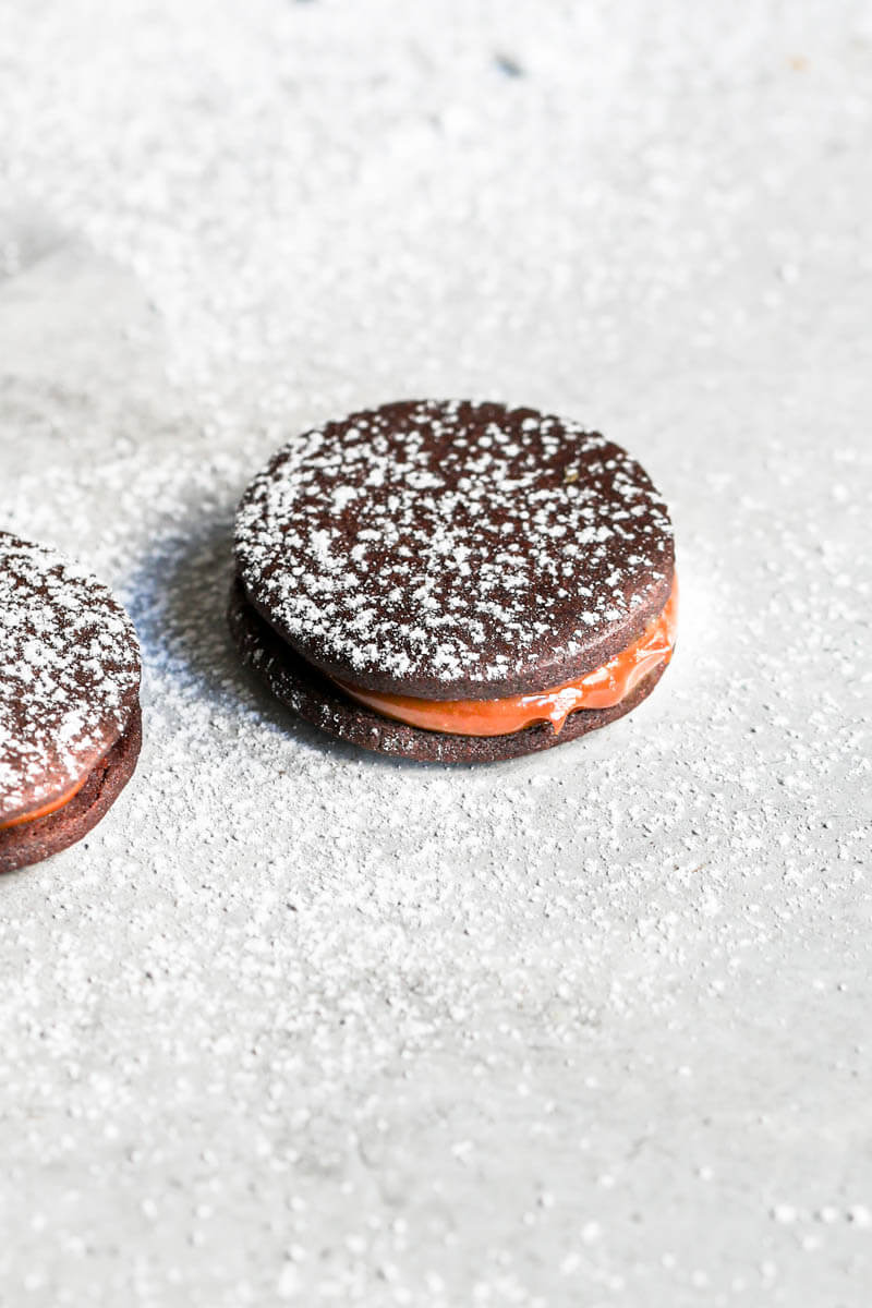 45° shot of one chocolate alfajor filled with dulce de leche