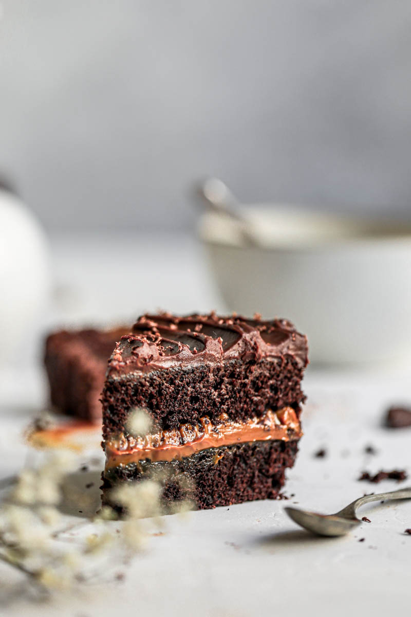 Closeup shot of one slice of chocolate dulce de leche cake