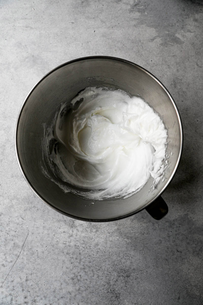 Beaten egg whites inside the mixing bowl.