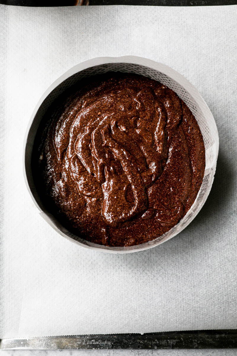 2/3 of the caked batter inside the cake pan ready for the oven.