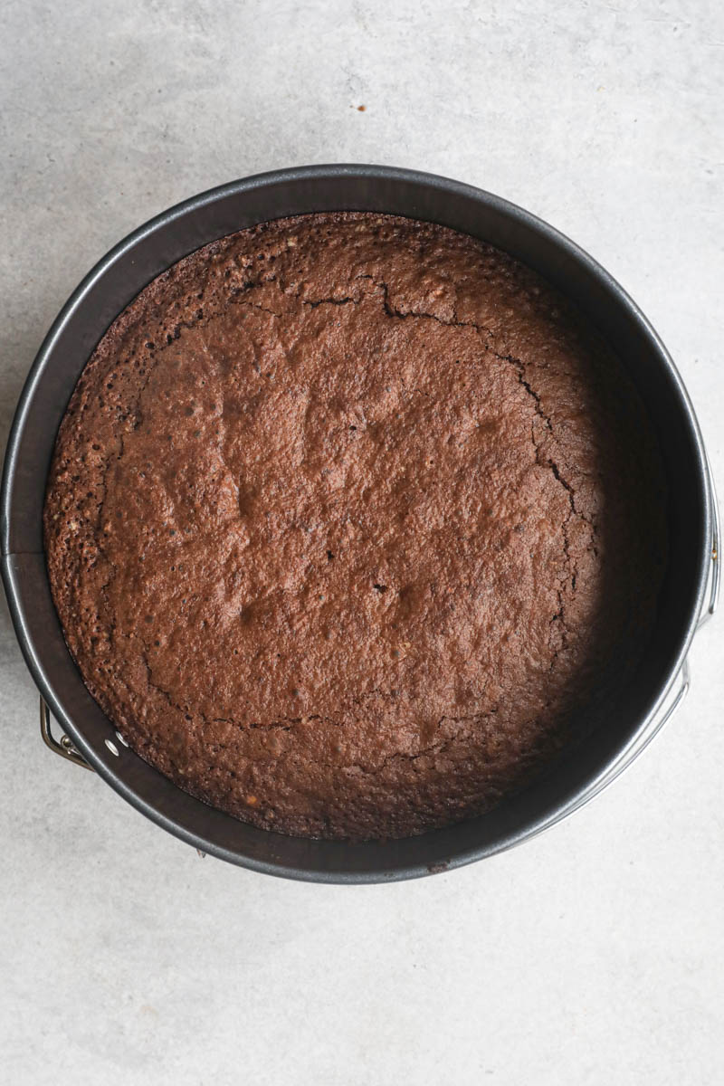 The baked chocolate hazelnut cake inside the baking pan.