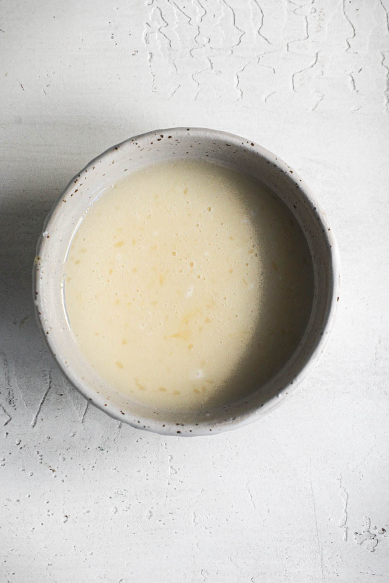 The orange glaze inside a small bowl.