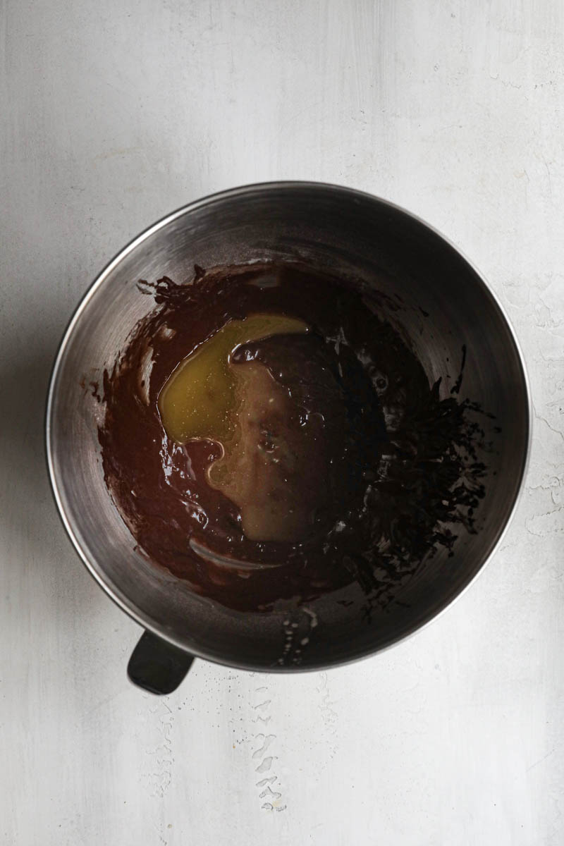 The chocolate madeleine batter plus the melted butter inside the mixing bowl.