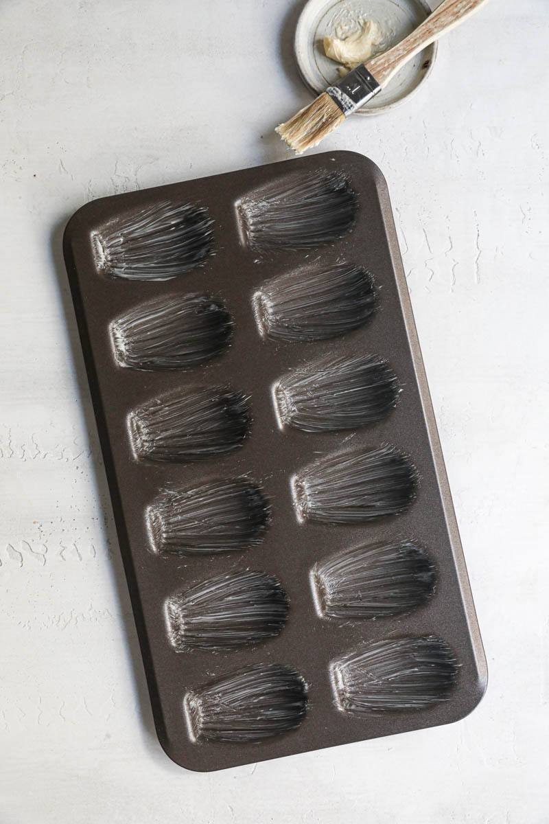 The buttered madeleine baking tray.