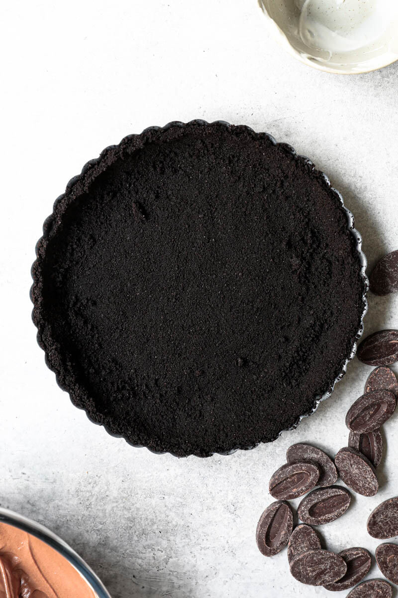 Overhead shot of the pie tin lined with the oreo pie crust