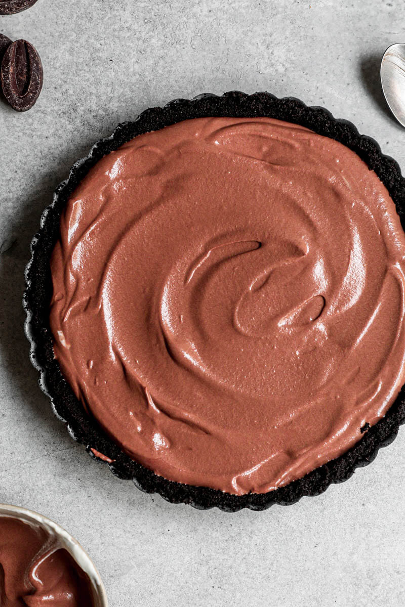 Overhead shot of the chocolate mousse pie filled with the chocolate mousse ready to be refrigerated