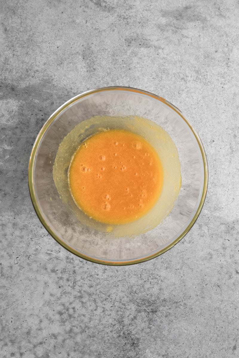 Whisk egg yolks + ½ the sugar