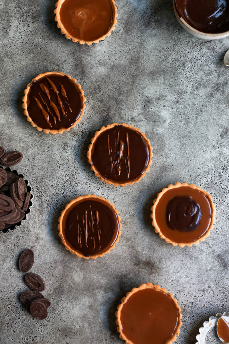 Overhead shot of the tartelettes topped with chocolate ganache