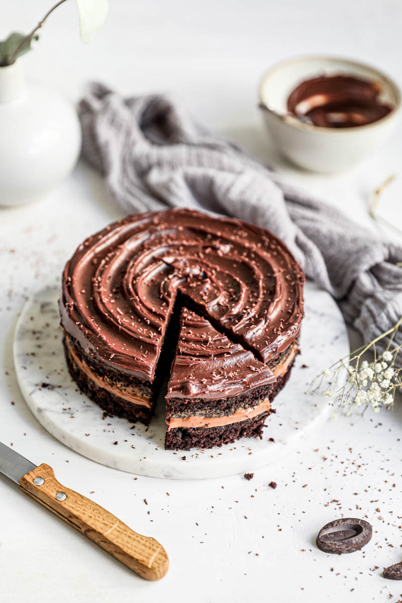 A chocoalte cake frosted with dark chocoalte ganache.