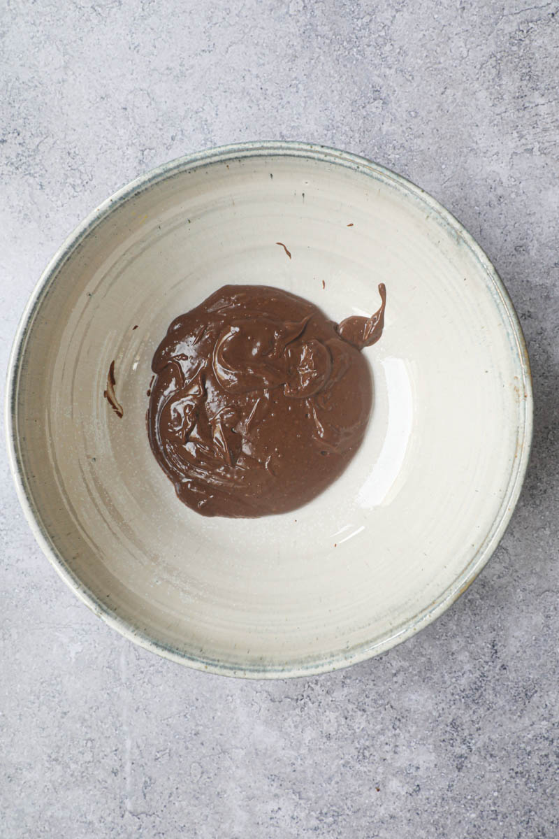 The chocolate pastry cream in a grey bowl.