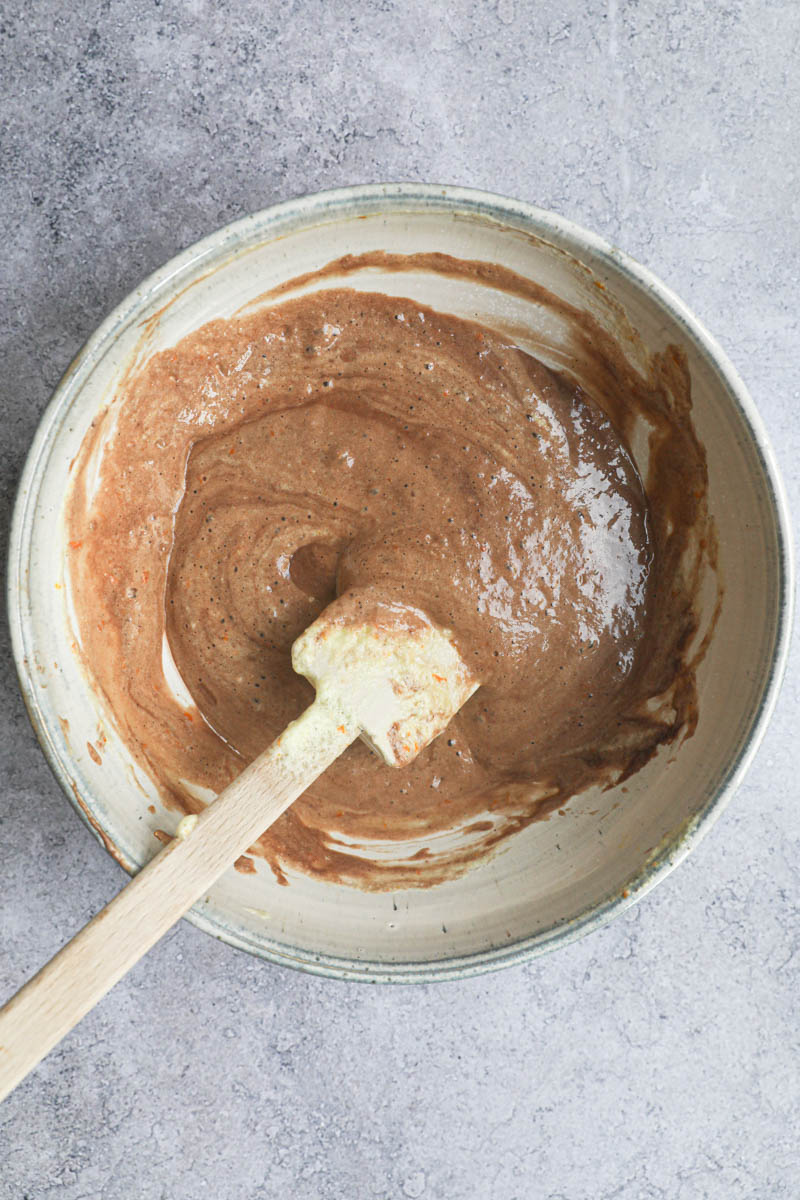 The chocolate souffle batter ready inside a grey bowl.