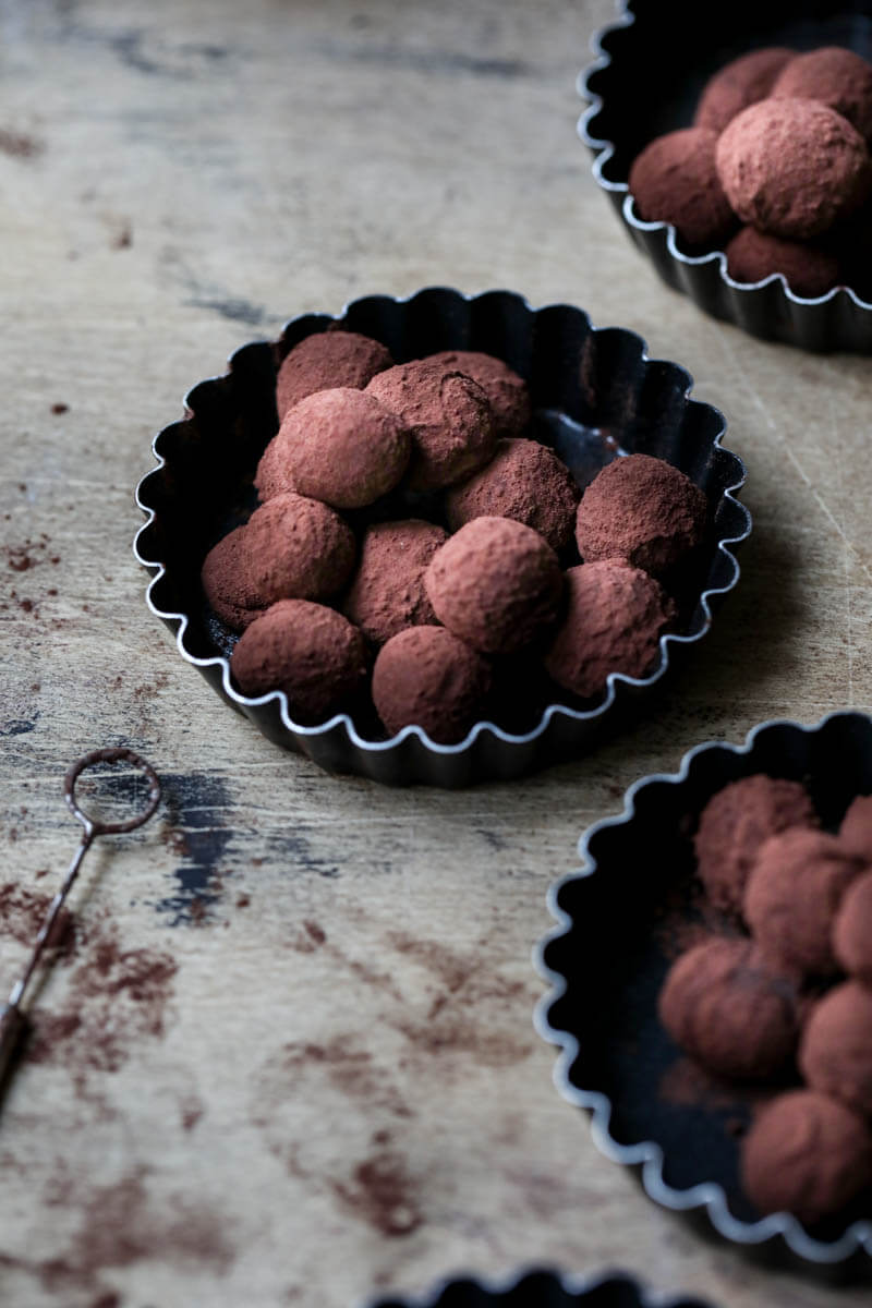 3 mini tart tins filled with dark chocolate truffles