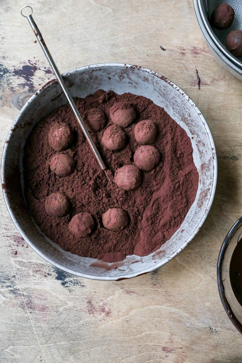 Plate filled with cocoa and chocolate truffles