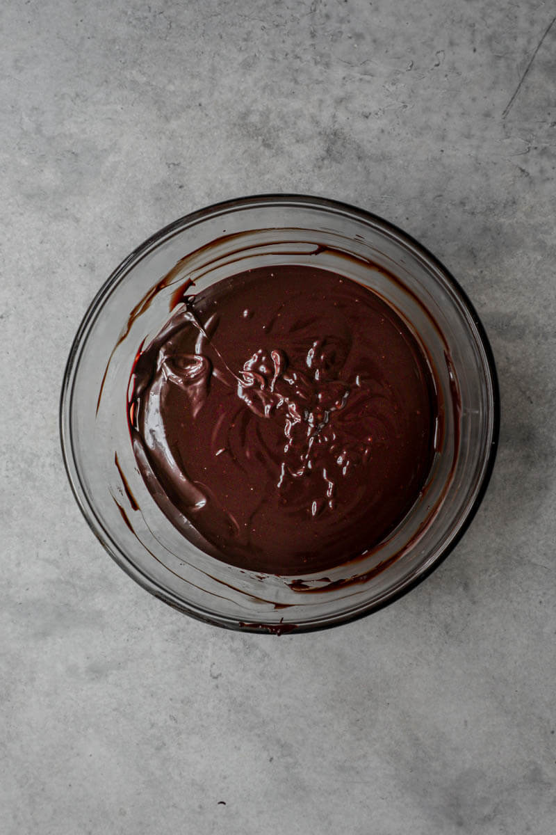 Dark chocolate ganache in a glass bowl