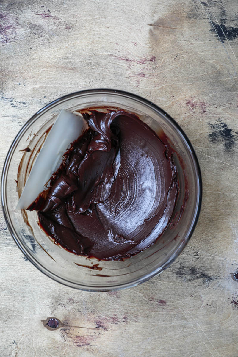 Dark chocolate ganache in a glass bowl