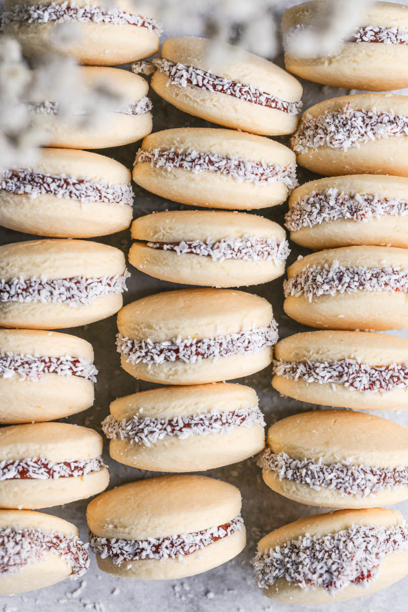Closeup of the filled alfajores cookies set up in 3 lines.
