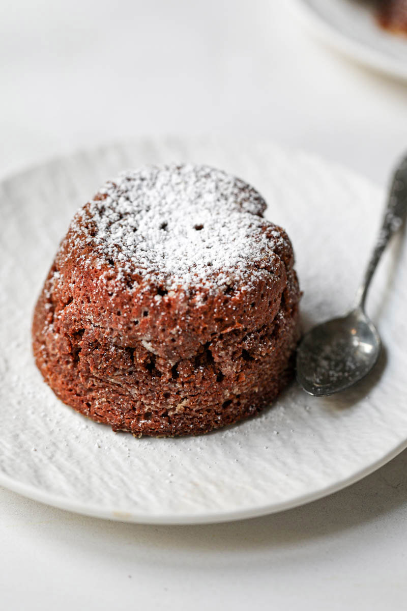 Closeup of the whole cake on a white plate.