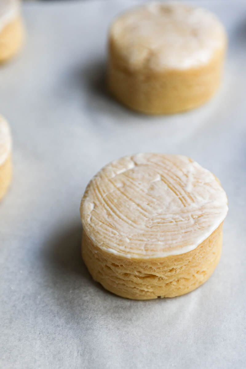 Closeup of a scone brushed with cream