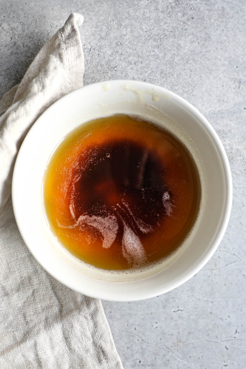 Brown butter in a white bowl.