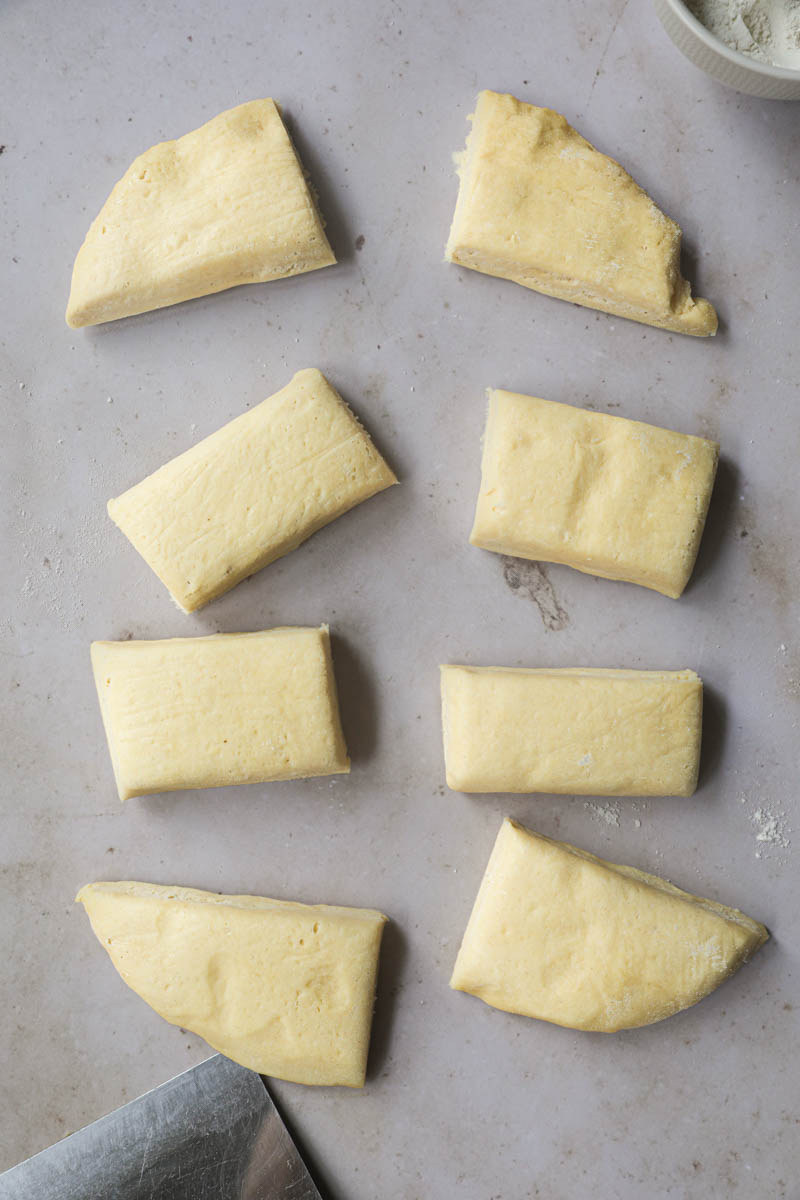 The French brioche bread dough cut in 8 equal pieces.