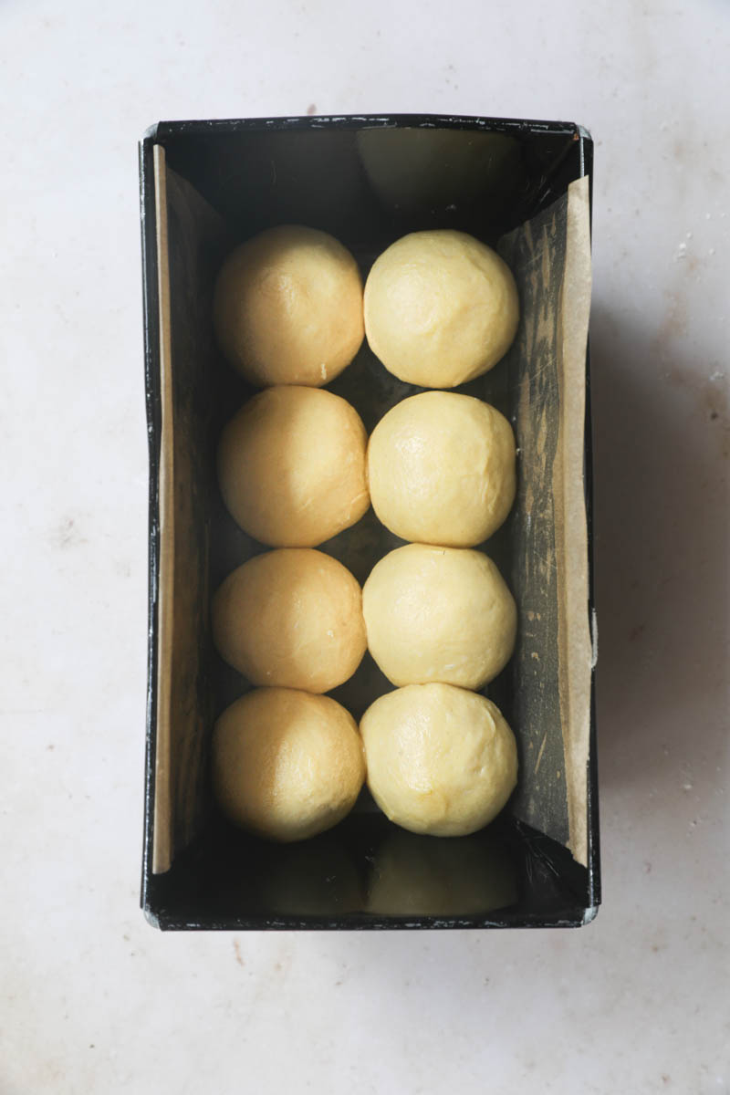 The brioche bread loaf inside the cake loaf pan ready for fermentation.