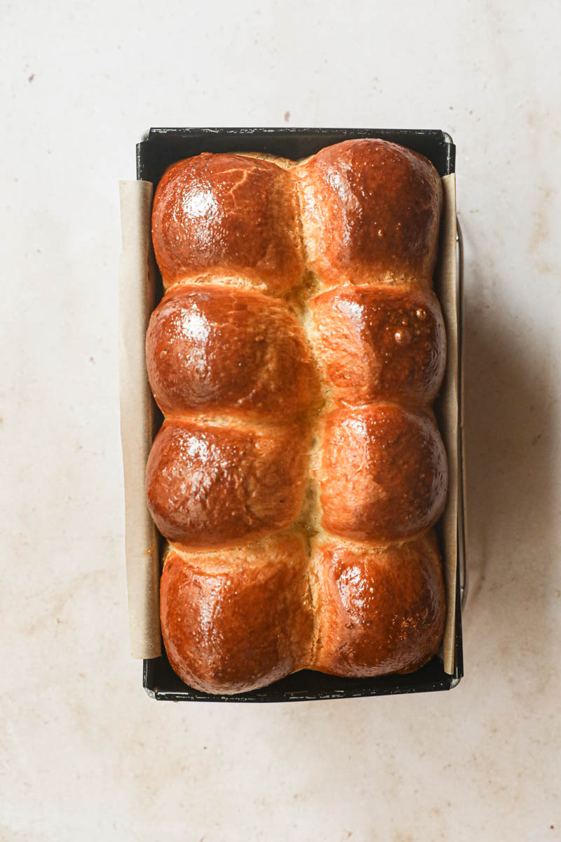 French brioche loaf bread baked inside the loaf pan.