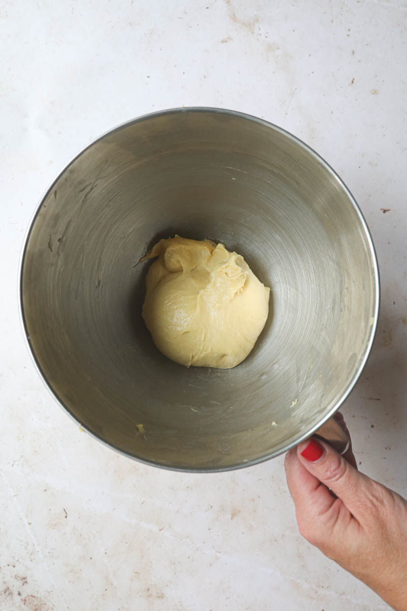 The French brioche bread dough ready inside the mixing bowl.
