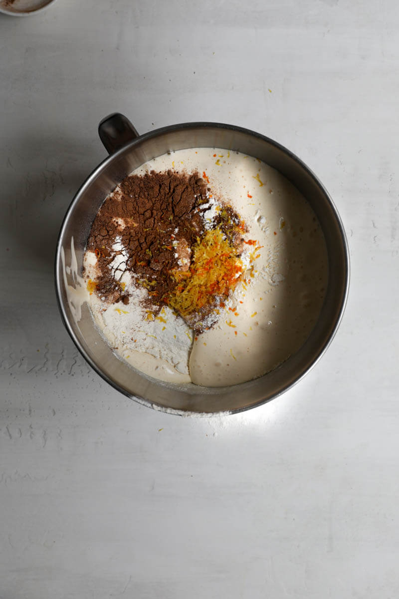 A bowl with the egg, sugar mixture plus flour, spices and citrus zests