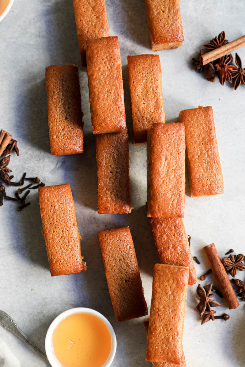 Pain d'épices baked and arranged irregularly on a countertop