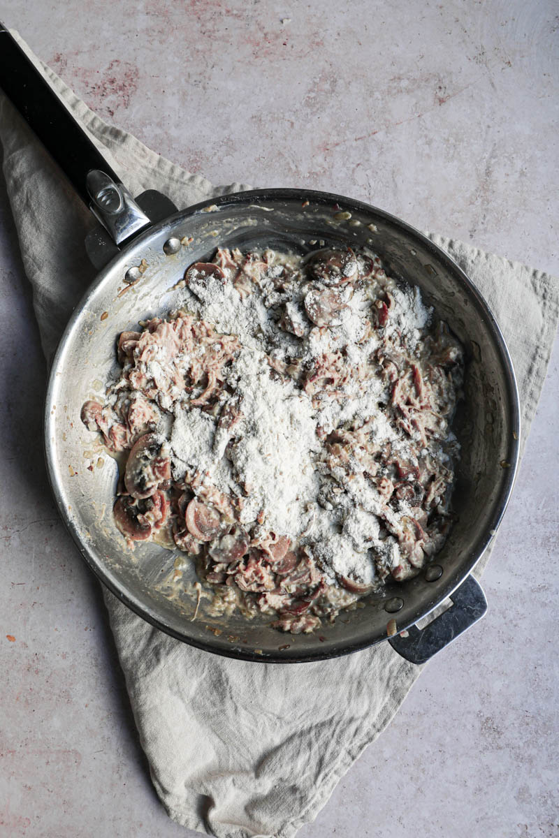 The mushroom and chicken crepe filling with the flour sprinkled on top.