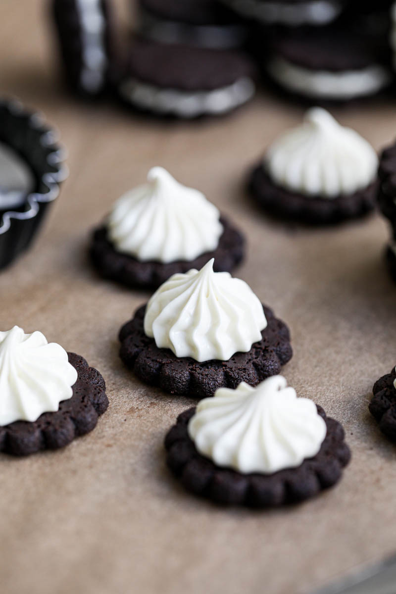 Closeup of Oreo cookies filled with a kiss of white chocolate ganache.