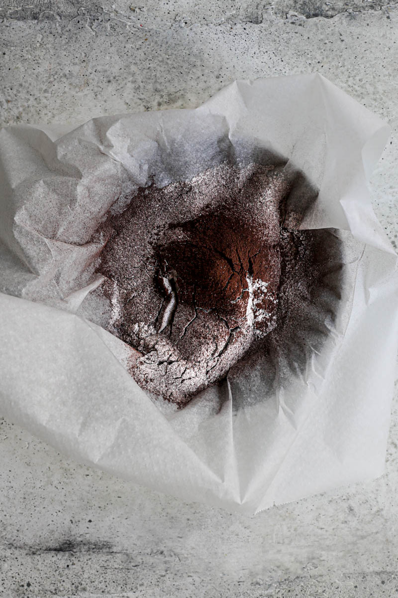 Making the homemade Oreo cookie dough: the sifted dry ingredients on a piece of parchement paper.