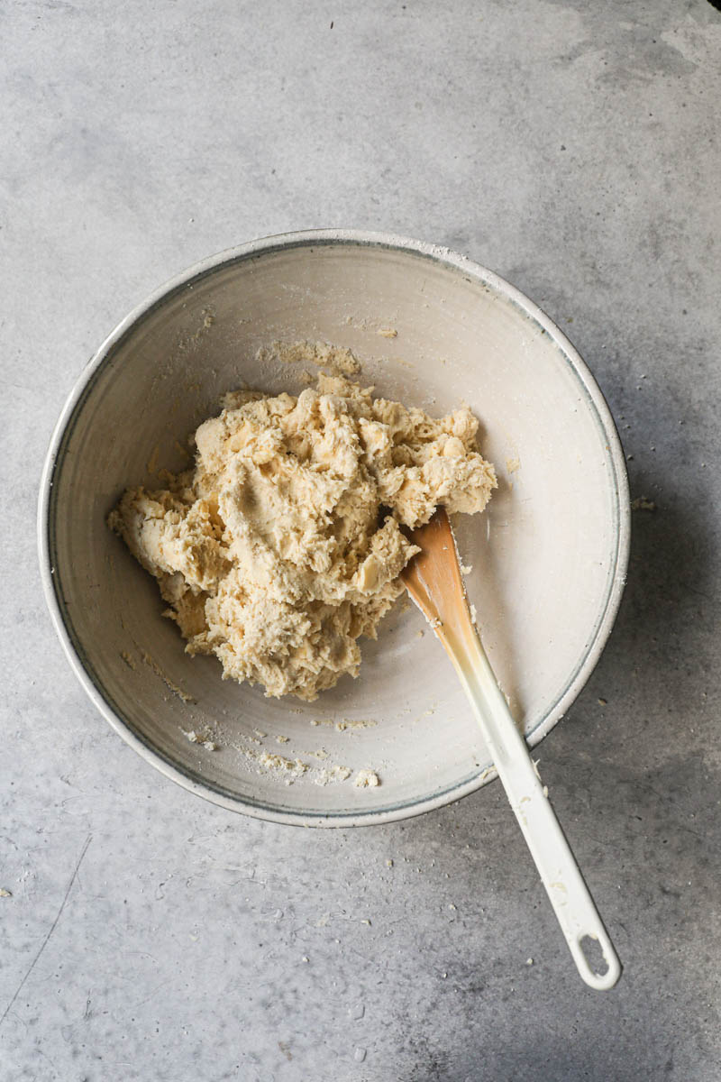 The rough puff pastry dough before kneading inside a bowl.