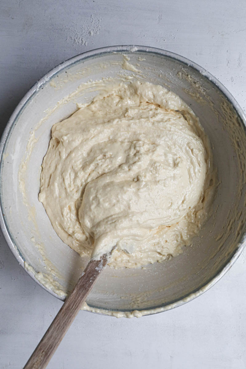 The ladyfingers cookies batter ready to be pippped out inside a bowl.