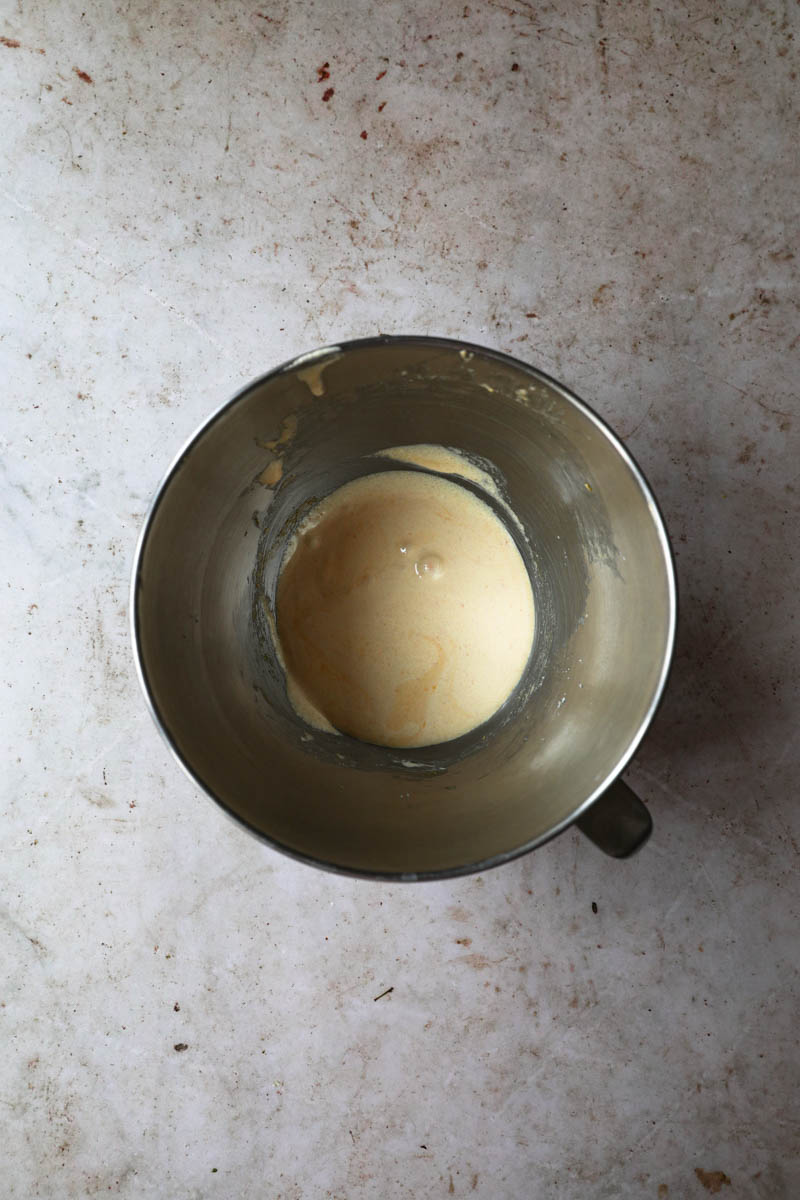 Blanched sugar and egg yolks inside a bowl.