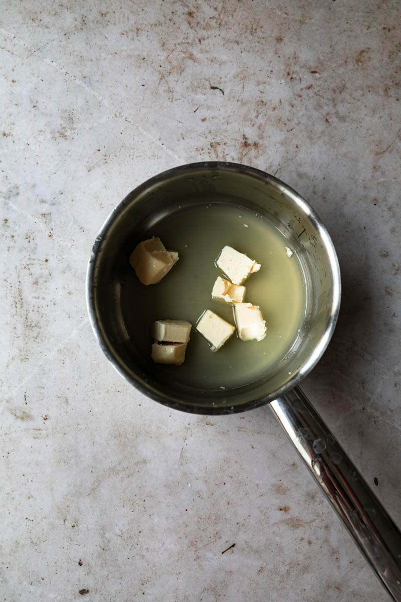 The butter and half the sugar inside a pan ready to start making the creamy lemon curd.