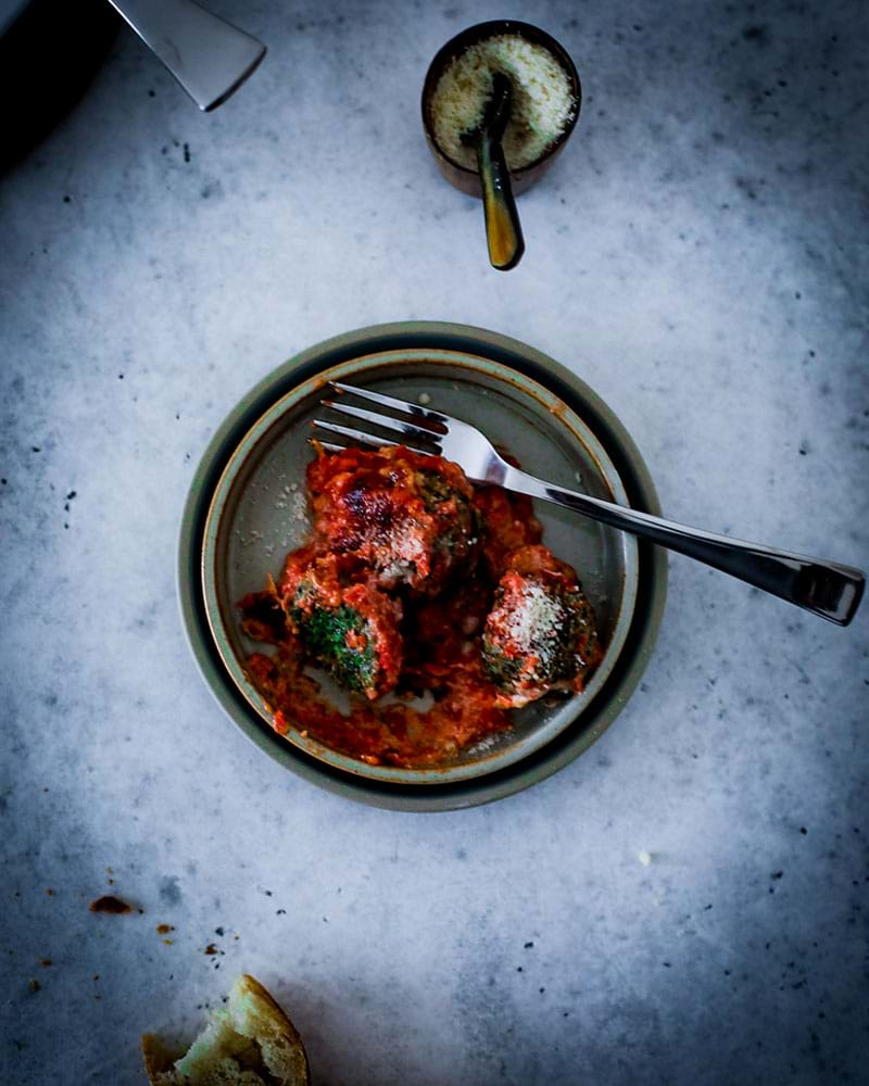 Overhead shot of the spinach malfatti on a light green plate