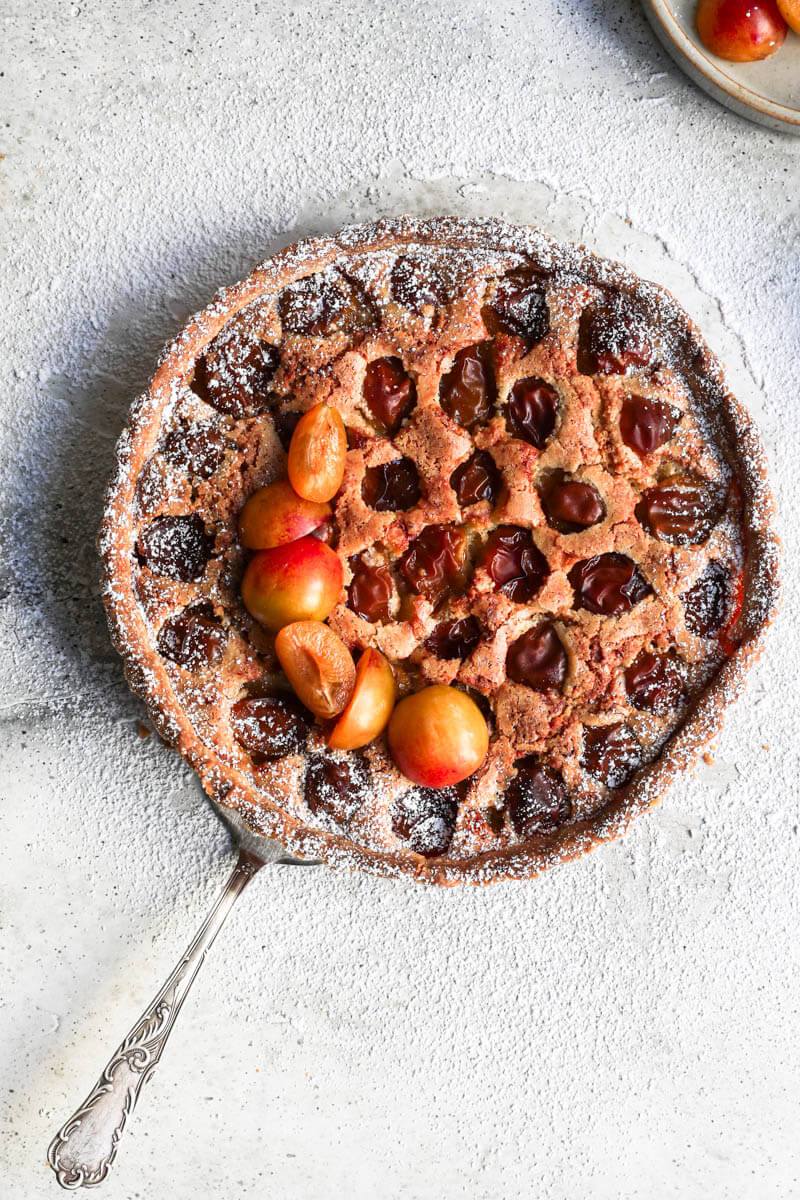 Overhead shot of the whole Mirabelle plum tart freshly out the oven