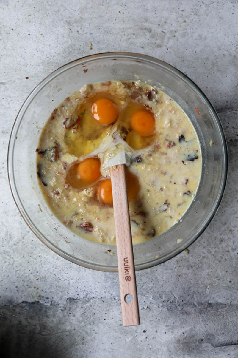Bowl with panettone soaked in milk, lemon zest and eggs