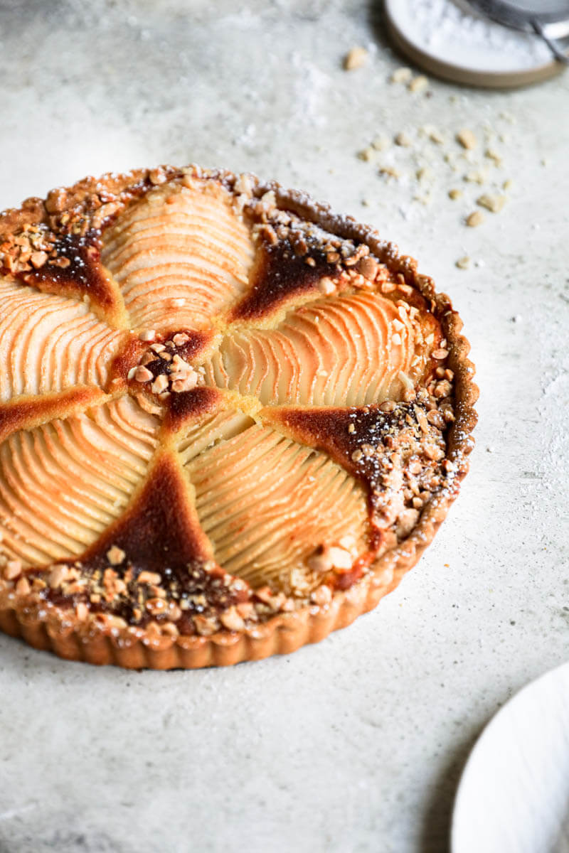 45° shot of the baked pear frangipane tart with syrup